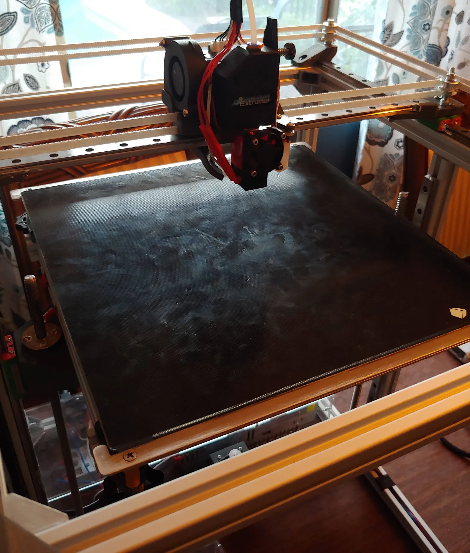 The printer sports linear rails on all axes, and a removable glass build plate. The platform is heated using a 750W AC heater