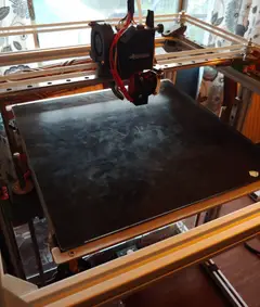 Thumbnail: The printer sports linear rails on all axes, and a removable glass build plate. The platform is heated using a 750W AC heater