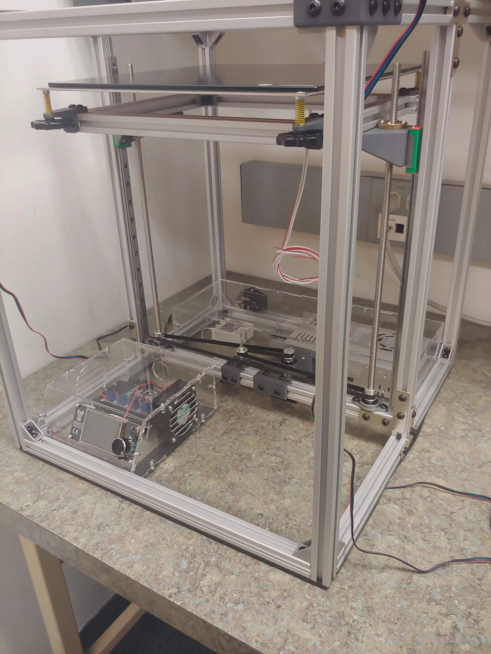 The electronics are mounted to laser-cut acrylic enclosures, and are separated into mains and non-mains boxes