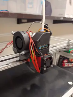 Thumbnail: The completed print head assembly (pre-wiring), with the hotend, extruder, and part cooling duct