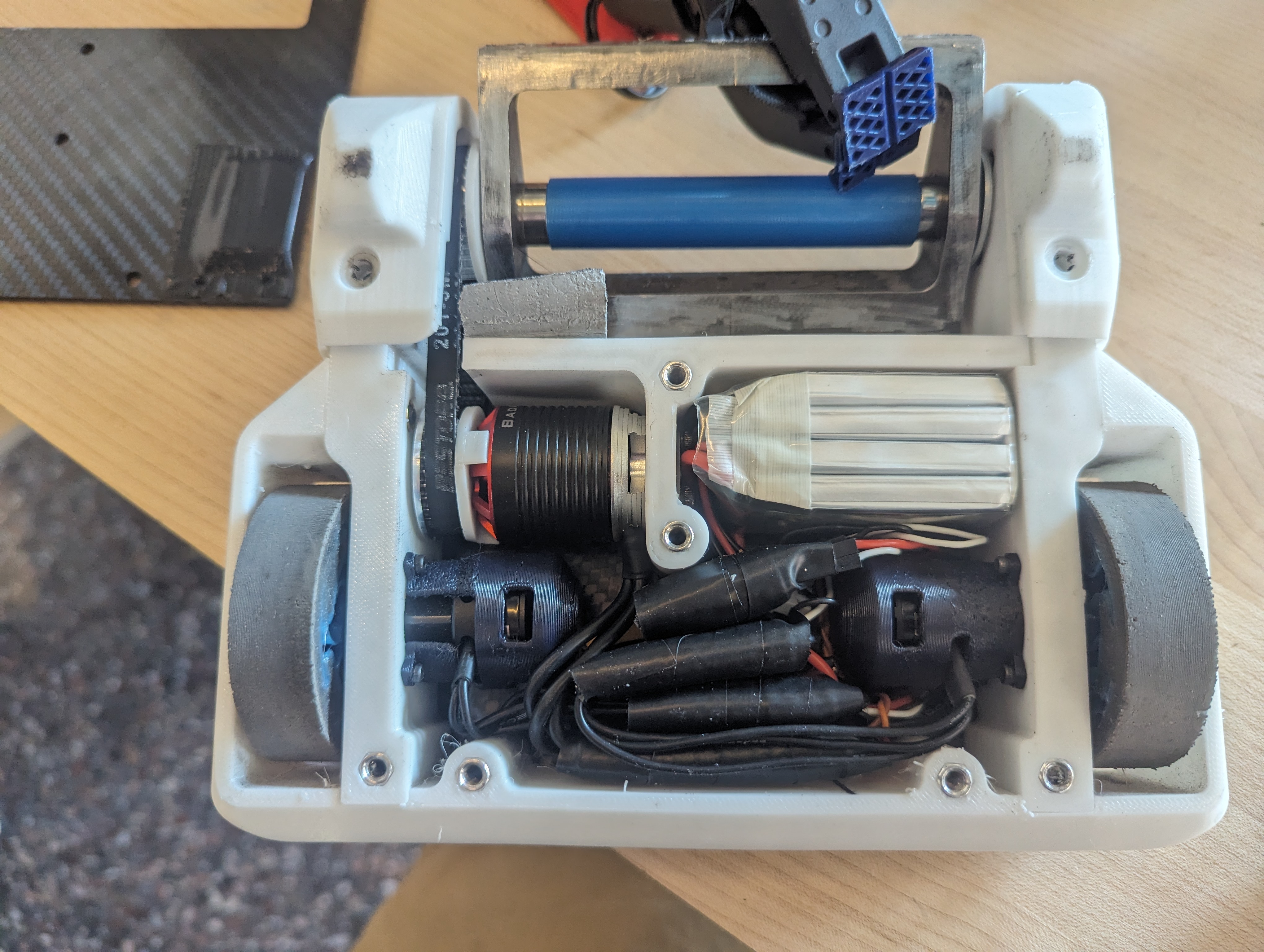 Internal electronics layout with motors, motor controllers, RC receiver, battery, and power distribution