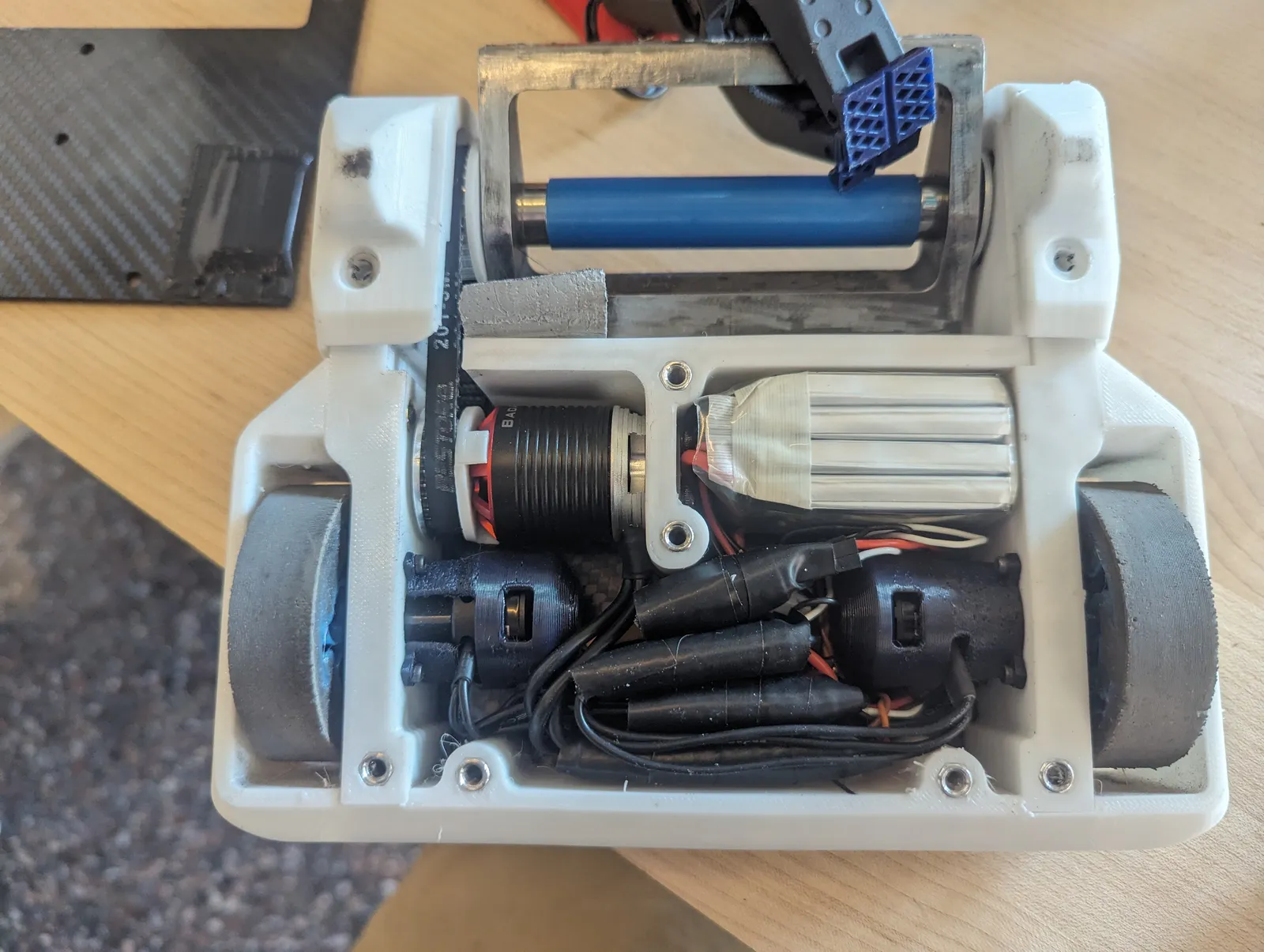 Internal electronics layout with motors, motor controllers, RC receiver, battery, and power distribution, with foam-wrapping around each board