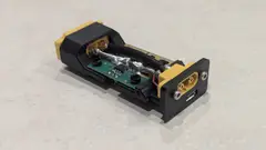 Thumbnail: Reverse side of Prototype 1 without the outer case, showing the hall effect current sensor module, and the power connections between XT-60 connectors